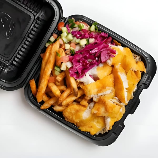 Halal chicken and fries with salad and red cabbage in a black takeout container.