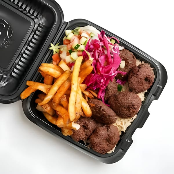 Halal platter with falafel, fries, rice, and fresh salad in a black takeout container.